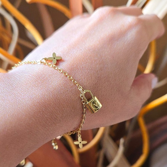 Jewelry - 18K Gold Designer Charm Bracelet with Lock and Flower Accents